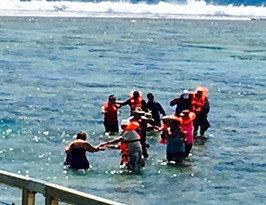 Tender Passengers Wading to Safety