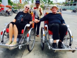 Author and Wife in Bike Rickshaws