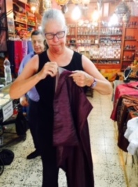 Jeanne with Dress, Shop Owner in Background